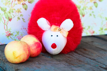Hedgehog toy with red apples