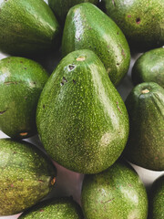 green fresh avocado on display