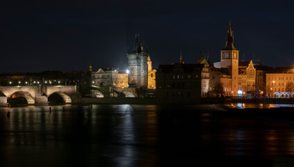 Fototapeta na wymiar .panoramic view of Charles Bridge and illuminated street lights and the surrounding old architecture in the center of Prague in the Czech Republic at night