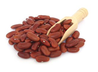 Red kidney beans with wooden scoop isolated on white background