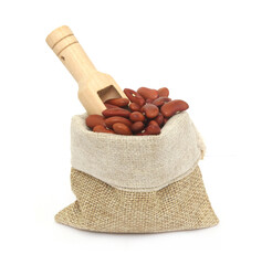 Red kidney beans with wooden scoop in burlap sack isolated on white background