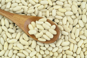 White beans with wooden spoon