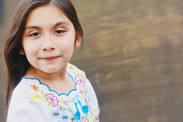 Little latin girl wearing typical clothes.