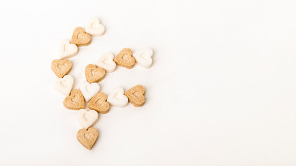 Sugar in the form of hearts on a white background