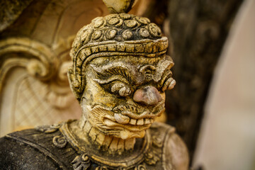 Old Buddha demon statue in close up