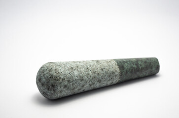 Pestle stone on a white background.