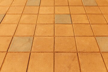 Brown cement tiles floor outside the building pattern and seamless background