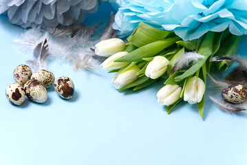 Easter background with eggs and white tulips.