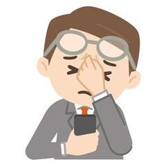 疲れ目のビジネスマン