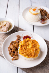 Fried Pork with Garlic, Pepper and fried egg on rice. Easy thai food.