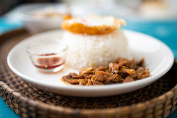 Fried Pork with Garlic, Pepper and fried egg on rice. Easy thai food.