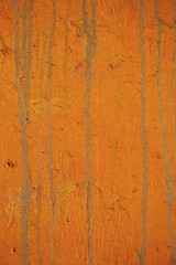 Obraz premium 狐色のペイントに垂れた跡の線が付いている古いコンクリートの壁