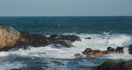 Fototapeta na wymiar Sea wave hit the coastal cliffs