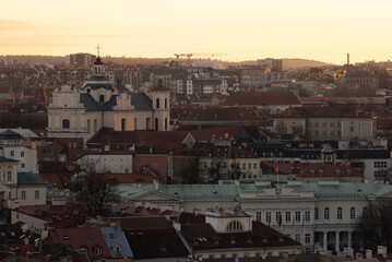 Fototapeta na wymiar sunrise or sunset above the Old Town of Vilnius, Lithuania