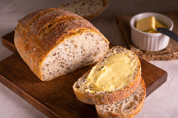 Breakfast with slice of freshly baked bread with butter