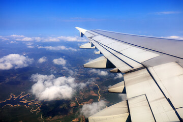 Fototapeta na wymiar Wings of large passenger aircraft, flying at high altitude, South China