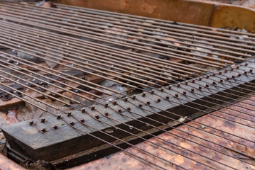 detail close up of old broken and rusty piano strings