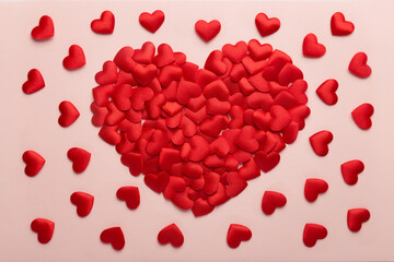 composition of many small hearts on a pink background for valentine's day