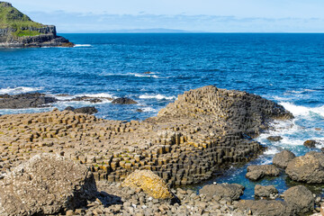 Landscape of Giant's Causeway trail with a blue sky in summer in Northern Ireland, County Antrim....