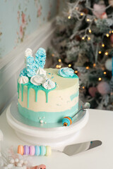 Wedding cake with candles and flowers in blu and wite colors