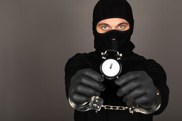 Man with black mask with handcuffs