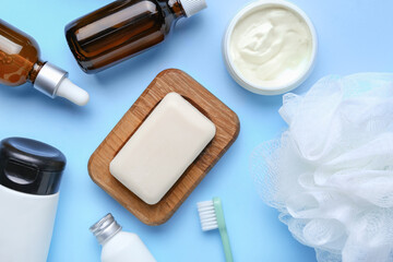 Bath cosmetics and accessories on color background