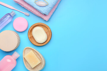 Bath cosmetics and accessories on color background