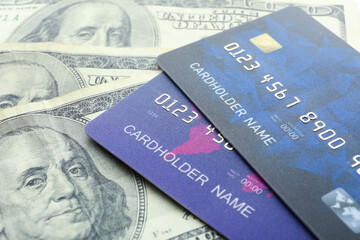 Credit cards with dollar banknotes, closeup