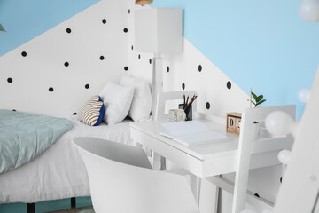 Interior of modern children's room with stylish table
