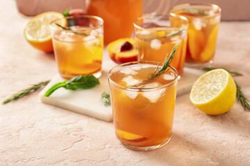 Glasses of tasty ice tea on light background