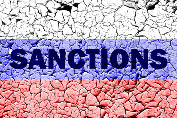 The flag of the Russia on a cracked wall with the words 