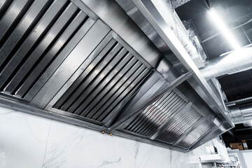 New clean stainless steel hood in professional kitchen - obrazy, fototapety, plakaty