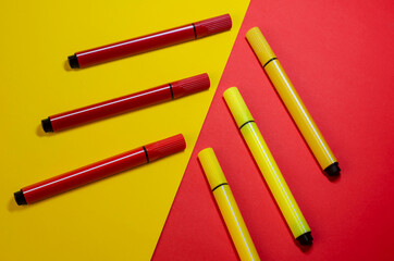 Creative two-color composition with red and yellow felt-tip pens.