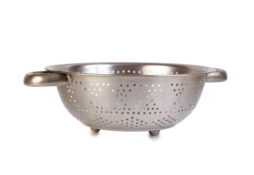 Large metal colander. Isolated object on white background