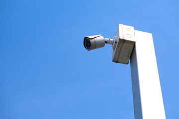 Closed circuit camera or CCTV camera with blue sky background.