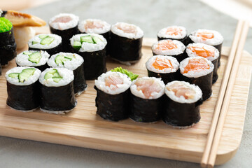 Maki sushi set served on wooden tray