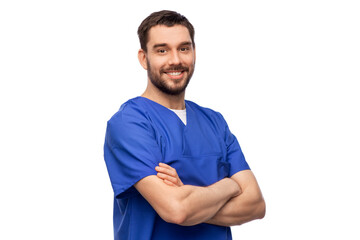 healthcare, profession and medicine concept - happy smiling doctor or male nurse in blue uniform with crossed arms over white background - obrazy, fototapety, plakaty