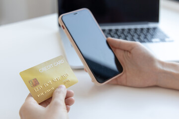 Businesswoman use mobile phones to register for security Online with a credit card to buy products online through application, Online shopping or Internet technology concept.