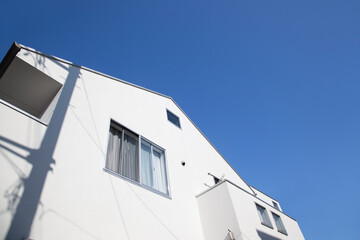 Urban architecture. Close up of a modern house  with blue sky.