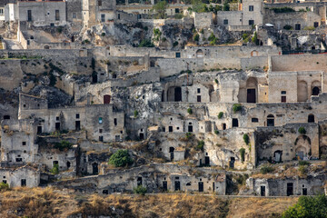 Obraz premium Panoramic view of Sassi di Matera a historic district in the city of Matera, well-known for their ancient cave dwellings from the Belvedere di Murgia Timone, Basilicata, Italy