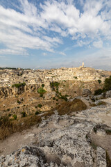 Panoramic view of Sassi di Matera a historic district in the city of Matera, well-known for their ancient cave dwellings from the Belvedere di Murgia Timone,  Basilicata, Italy