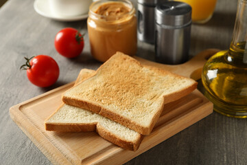 Fototapeta na wymiar Concept of cooking toast on gray table