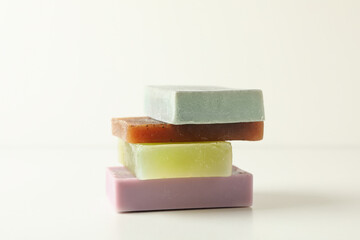 Pile of natural soap on white background