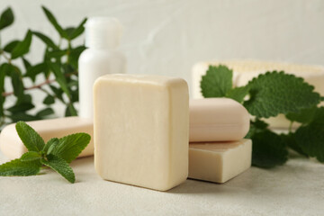 Concept of personal hygiene with natural soap on beige table