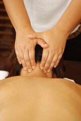 Fototapeta na wymiar Massage of body for young woman in beauty salon