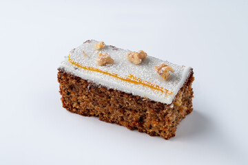 Carrot cake pastry with sugar coat and nuts on top,?white background with soft shadow