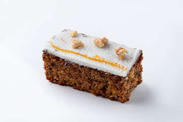 Carrot cake pastry with sugar coat and nuts on top,?white background with soft shadow