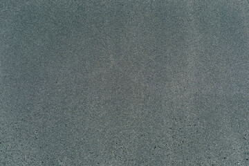 Close-up macro view of black color volcanic sand surface