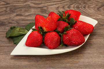 Ripe sweet strawberry with leaf