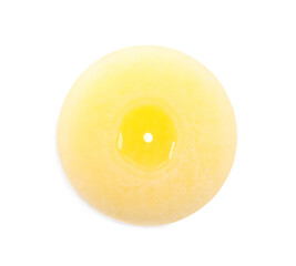 Burning yellow wax candle isolated on white, top view